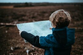 This child has been given an opportunity to enhance his self-esteem and self-efficacy by using this map to determine where he should go as he looks out over the landscape ahead of him.