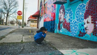 Unsafe environments can be physical space, such as this city street which shows a child alone on the sidewalk. They can also be online spaces.