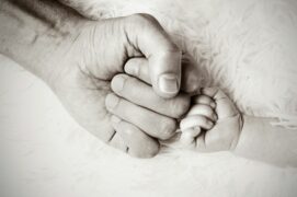 A support network empowers children to partner with adults for their own safety. This image shows a fist bump between an adult and a child; sipporting each other.