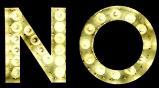 This is a marquee-style sign of the word 'no' and is yellow. Teaching our children that it's okay to say no is empowering and crucial for their protection.