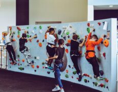 Promoting physical health, such as these children climbing a rock wall, has been shown to help goster resilience and post-traumatic growth.