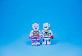 Are your relationships based on lust, infatuation, or love? Pictured here are two brick-style minifigures on a blue background.