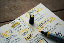 Intentional planning can help ensure goals are met with values in tact. This image shows how someone is taking time to set goals and plan in a notebook using lists, checkboxes, and multiple colors.